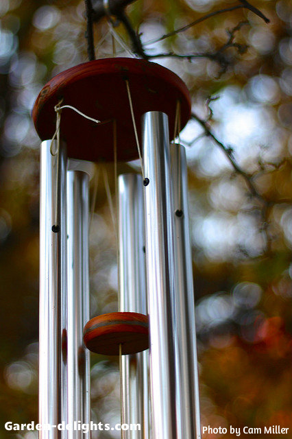  Finely tuned aluminum windchimes with small light brown wooden striker with a wooden topper tying the aluminum tubes together by dedicated craftsmans creating a beautiful rich tone for the backyard, unique windchimes, Google Sun catchers, whimsical windchimes, windchimes Garden Art, wonderful windchimes, sweet windchimes, shiny aluminum windchimes.
