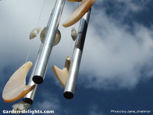  Aluminum tube windchimes with antique moon and stars hanging from a top wooden mount with a glass striker ball, aluminum and glass windchimes, wind chime mobile, windchimes Google, wind chime ideas, suncatcher windchimes, jingle jangle windchimes, awesome windchimes.