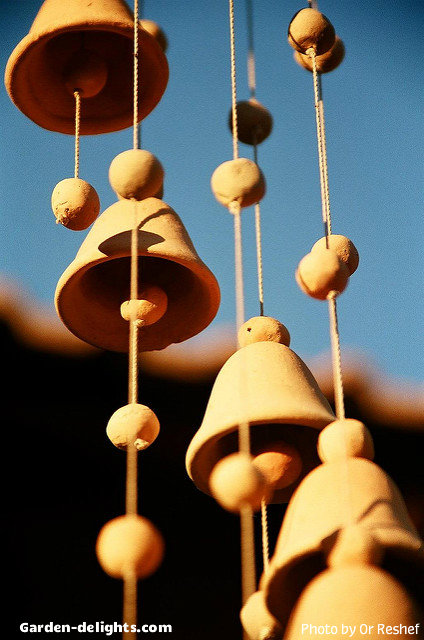  Ceramic pottery wind chime bells with small pottery clay balls on a string just love these hanging chimes, ceramics inspiration windchimes, ceramic bells, hanging chimes, porcelain bells, handing ceramic wind bells, ceramic bells mobile windchimes, awesome windchimes Google search, lights and color wind bells that sparked the imagination of the dream garden.
