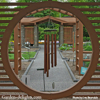 Copper wind chimes mounted in round cedar trellis under arch focal point for garden, handcrafted copper wind chimes, hanging wind chimes,chimes hanging, hanging wind, garden handcrafted, handcrafted copper, arch focal, round arbor, round Cedar, cedar trellis