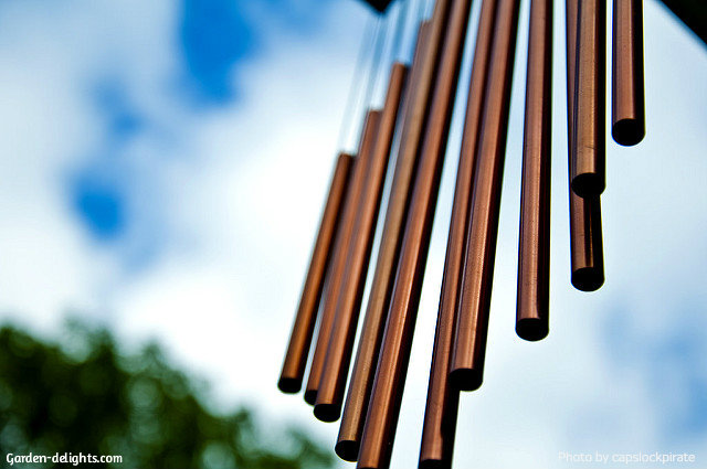 Long copper wind chimes, Dark bronze color copper chimes hanging down from gazebo overhang