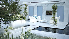 Modern Outdoor Furniture, two white loveseat with coffee table in court yard with water in patio floor.