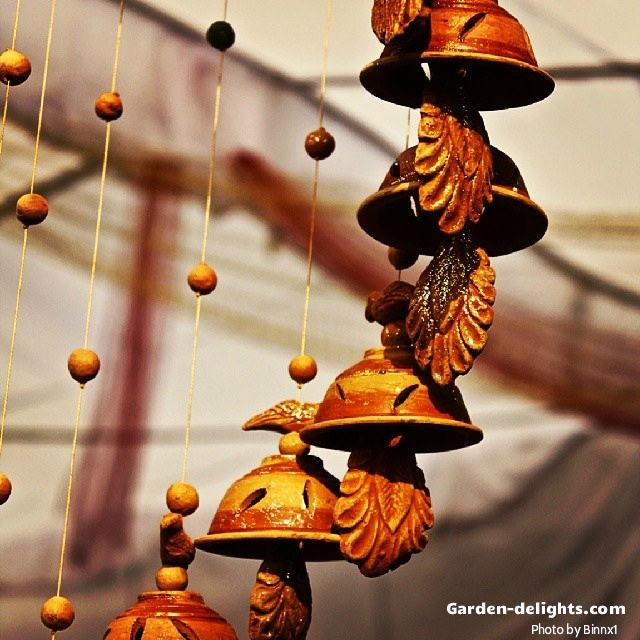  Orange, yellow ring colors on ceramic spiral bells windchimes mobile with beautiful leaf pattern strikers and small decorative beads, whimsical windchimes mobile Suncatchers, colorful ceramic windchimes, hand-etched ceramic bell windchimes clay bell chimes, pottery bells, decorative ceramic windchimes leaf design, Google search sound ceramic garden windchimes.