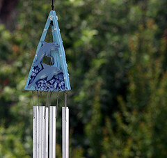 Blue dolphin wind chimes hung on a tree,Outdoor wind chimes,garden wind chimes.
