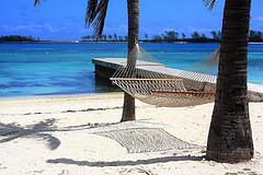 Hammock hung on beach with dock in background,Portable Hammocks,Hammocks.