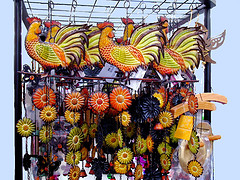 Rooster wind chimes hanging from rack with metal flowers,Rooster wind chimes, Unique wind chimes.