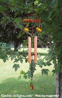 Small copper wind chimes with beads and stained-glass diamond wind catcher with bamboo ring top, modern tuned wind chimes, illuminated wind chimes.