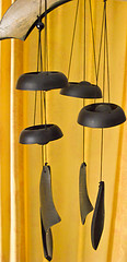 Wooden wind chimes hanging with orange background,bamboo wind chimes,Unique wind chimes.