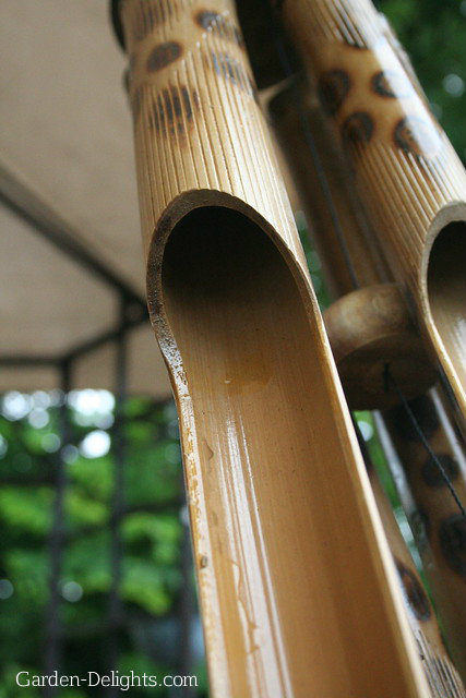 Hanging bamboo wind chime reeds with decorative spotting. Bamboo wind chimes, windchimes, Feng Shui windchimes.