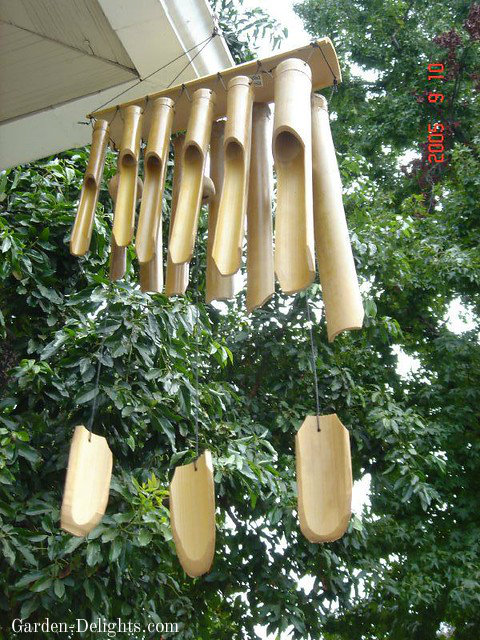 Multiple hanging bamboo tubes wind chime with bamboo wind catchers. Natural wood windchimes, feng shui windchimes